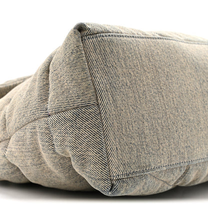 Quilted denim puffer satchel with structured seam detail