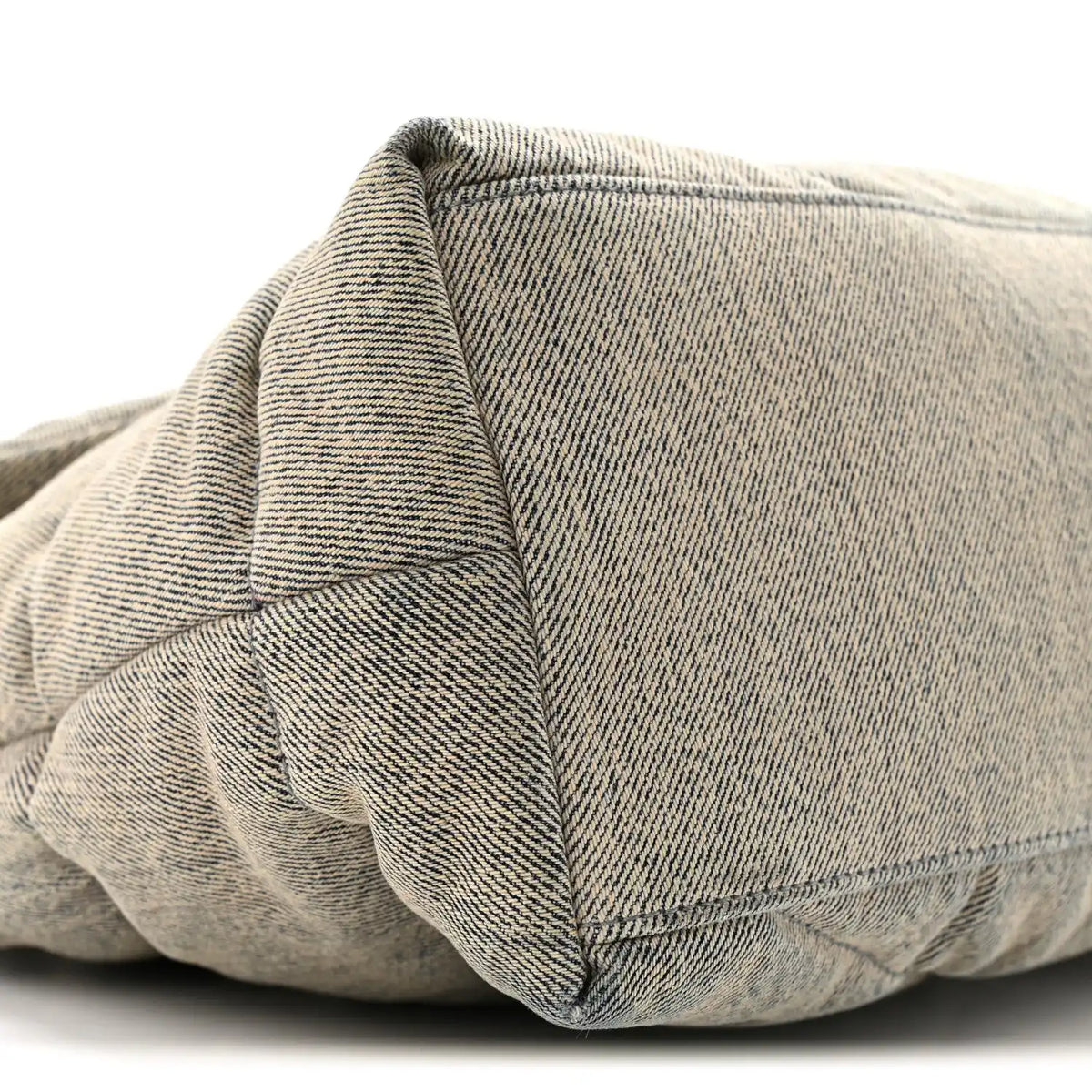 Quilted denim puffer satchel with structured seam detail