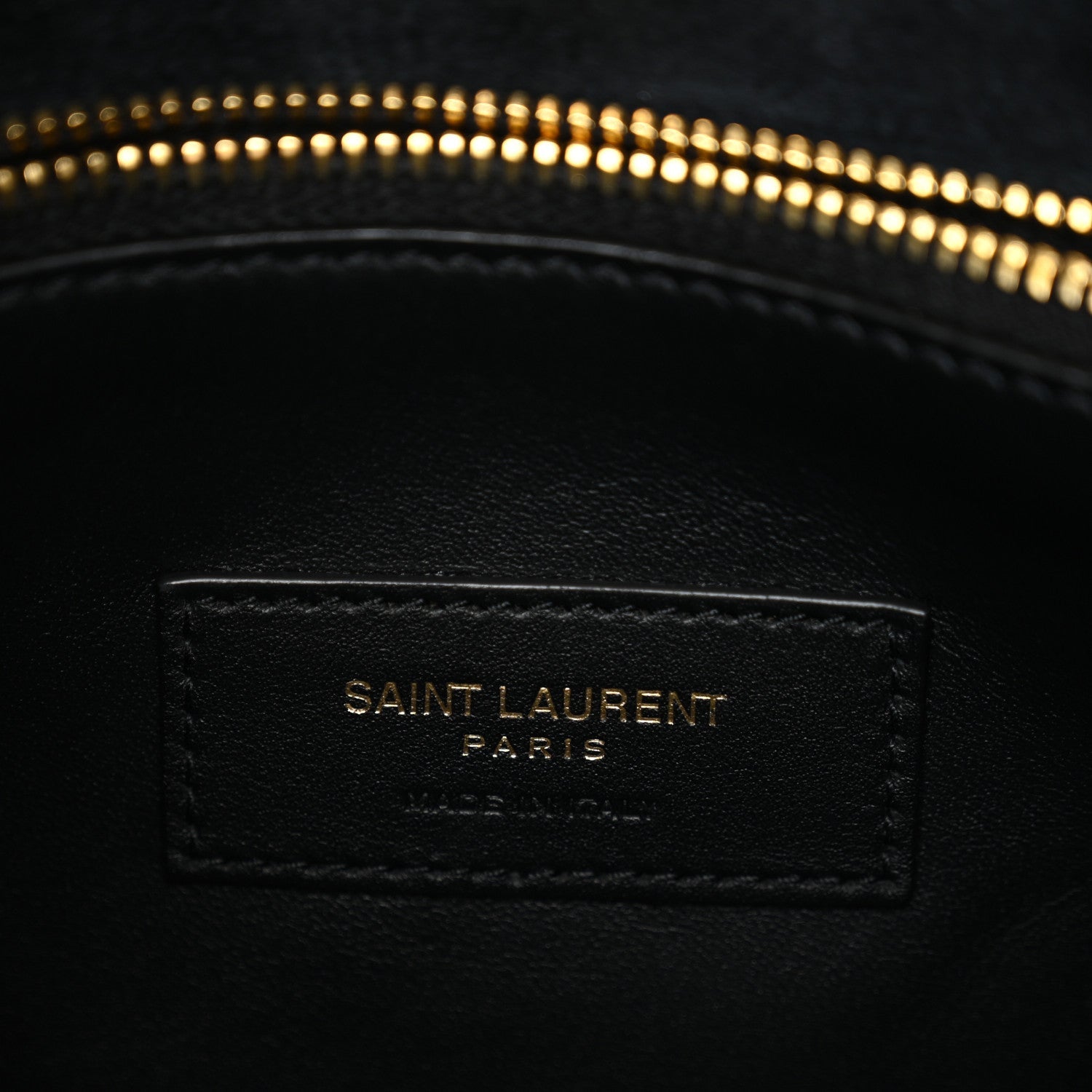 Black leather interior patch label with "SAINT LAURENT PARIS" text.