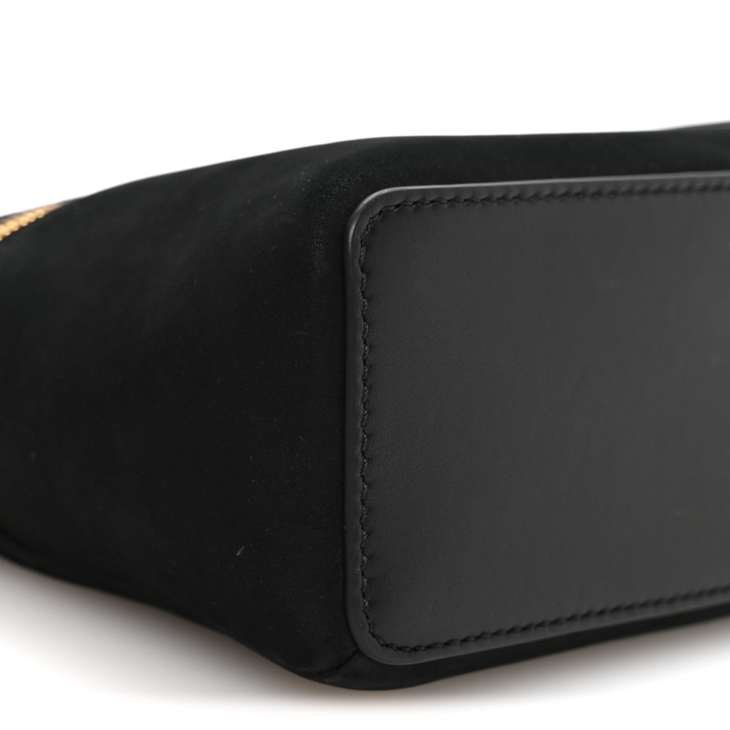 Black pouch corner with stitched rectangular leather patch