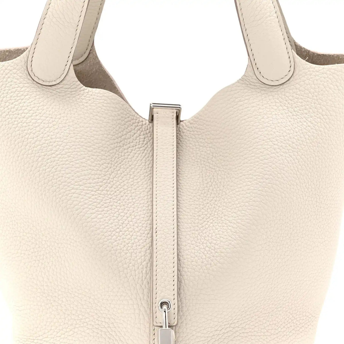 Off-white leather bucket bag top with two handles and central zipper pull