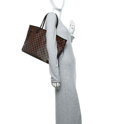 Damier Ebene tote bag, brown check canvas with leather trim, worn side view on mannequin