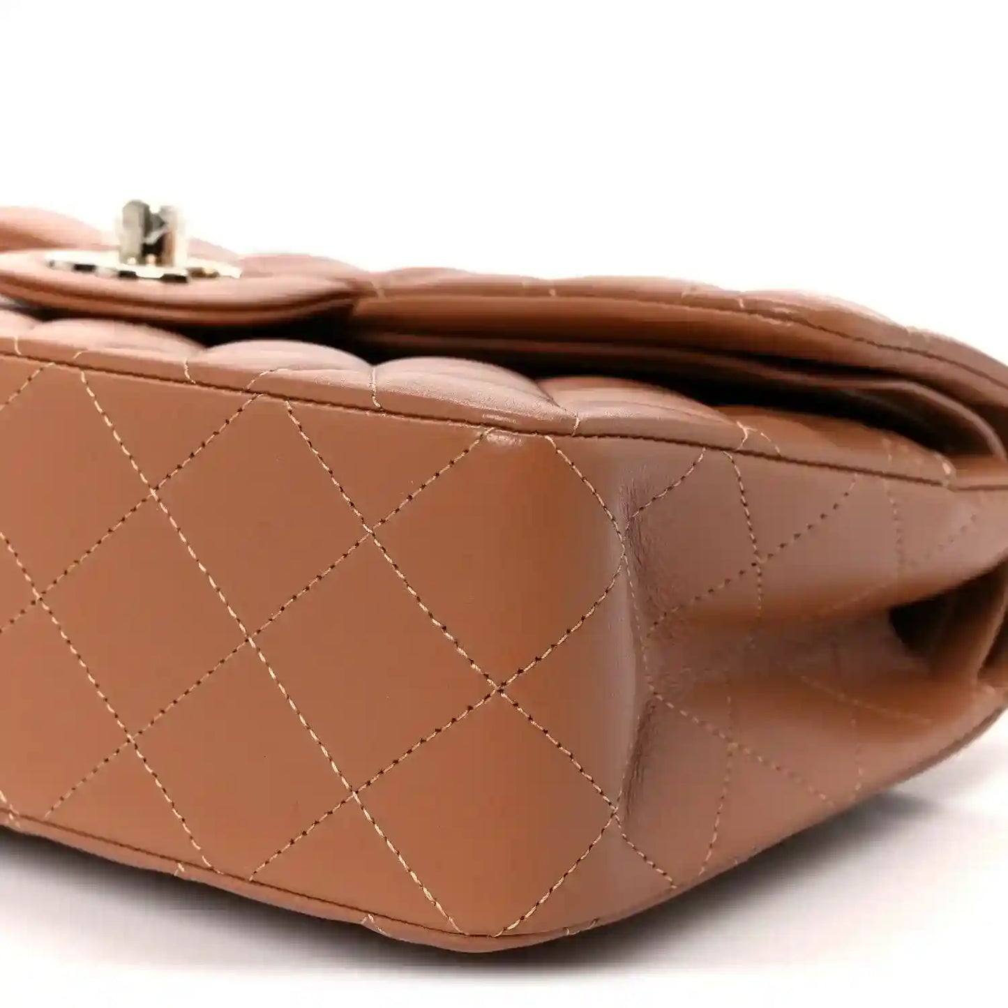 Brown quilted lambskin shoulder bag detail with diamond stitching and top handle