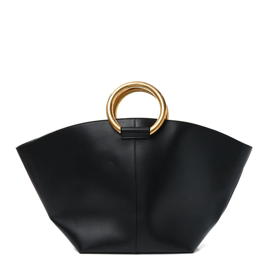 Black smooth calfskin maxi trapezoid tote with gold top ring handles and center seam