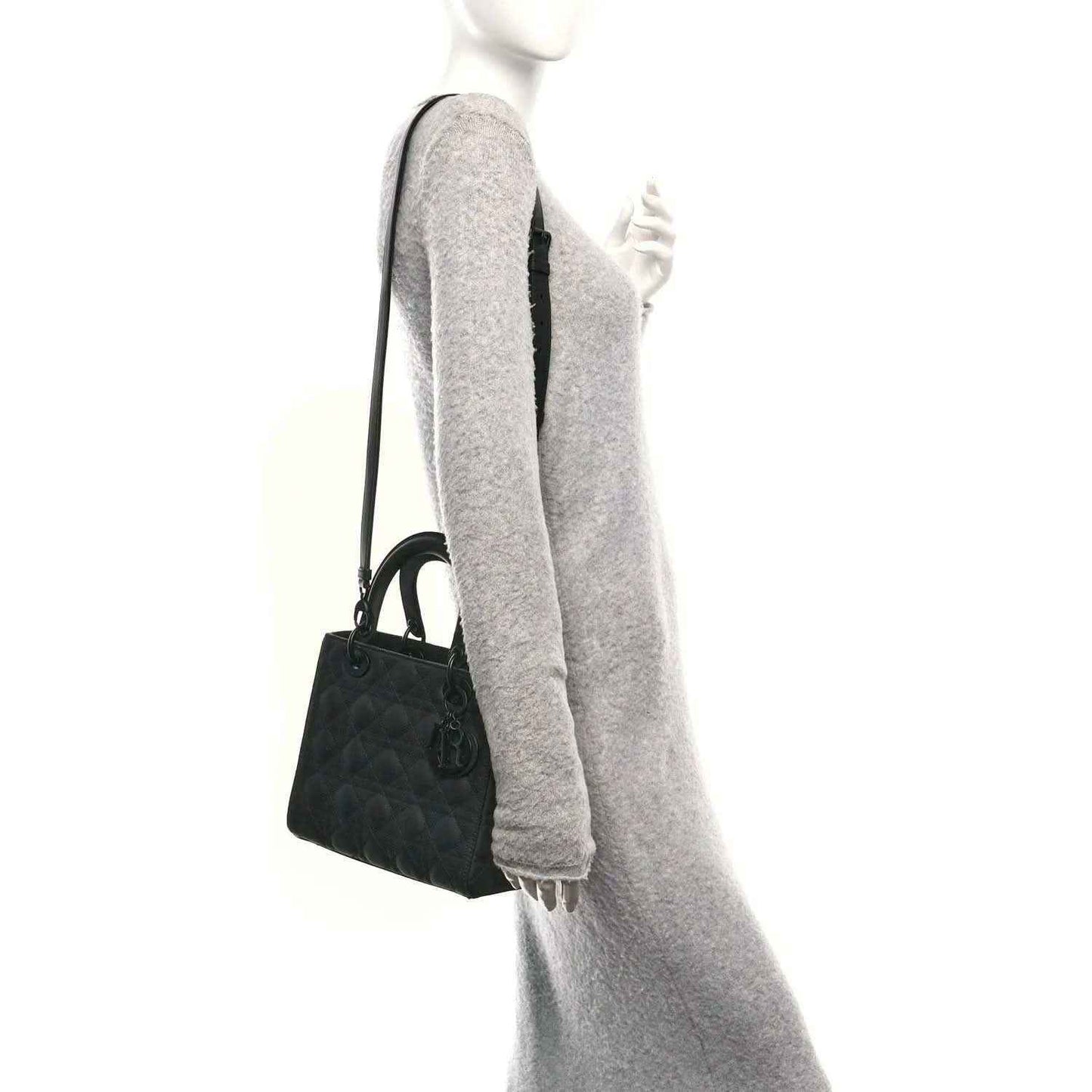 Black Lady Dior handbag with short handles and adjustable crossbody strap