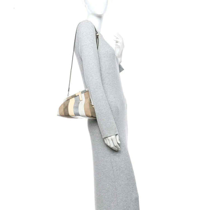 Striped nappa suede clutch worn crossbody, with long detachable strap