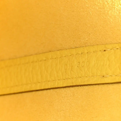 Lime leather seam with stamped marking along the edge