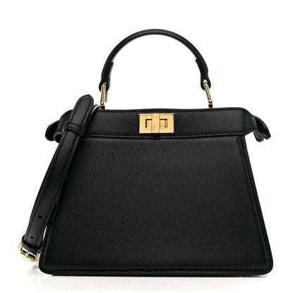 Black leather satchel with top handle and gold-toned clasp