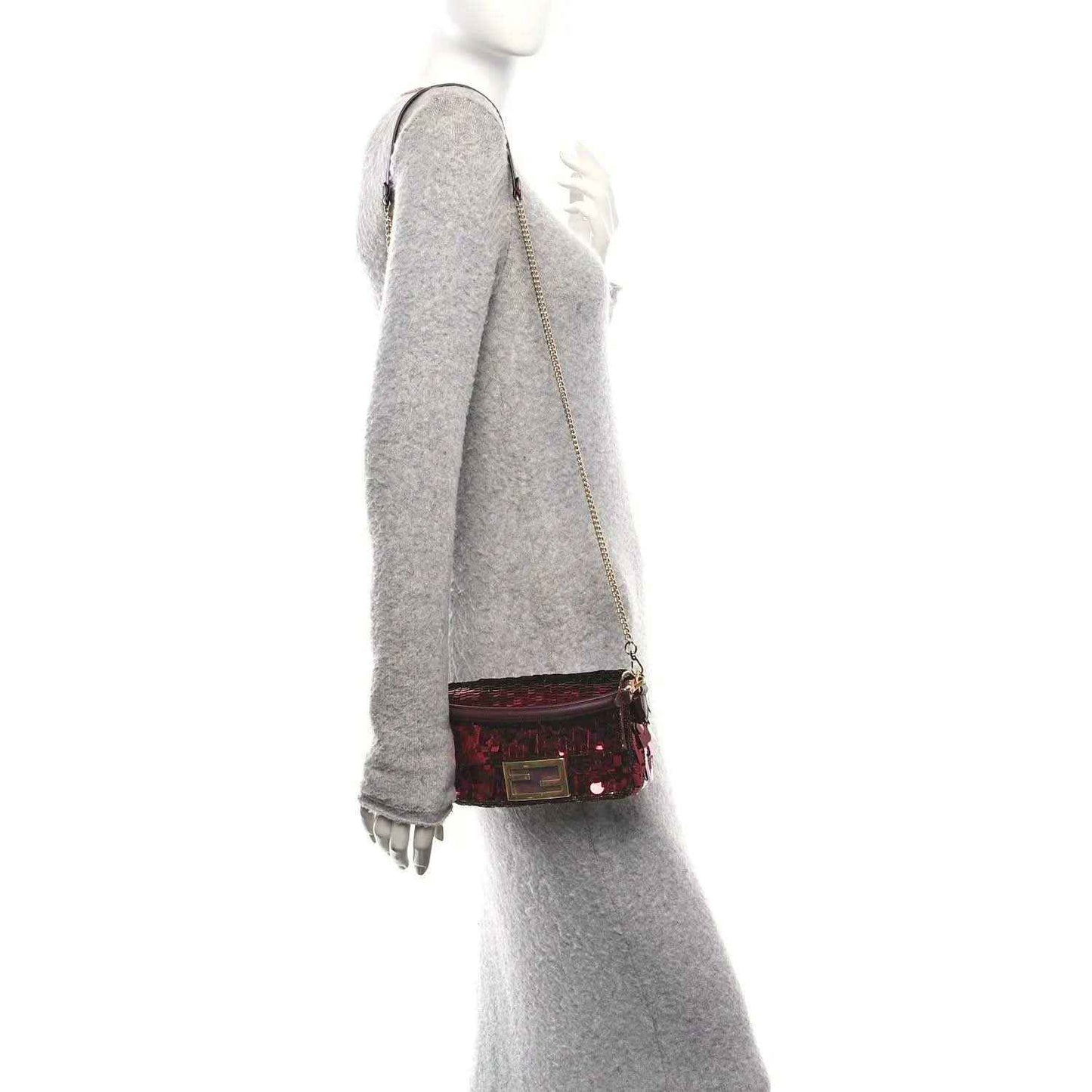 Mini baguette handbag worn crossbody, red sequin body with chain strap and gold clasp