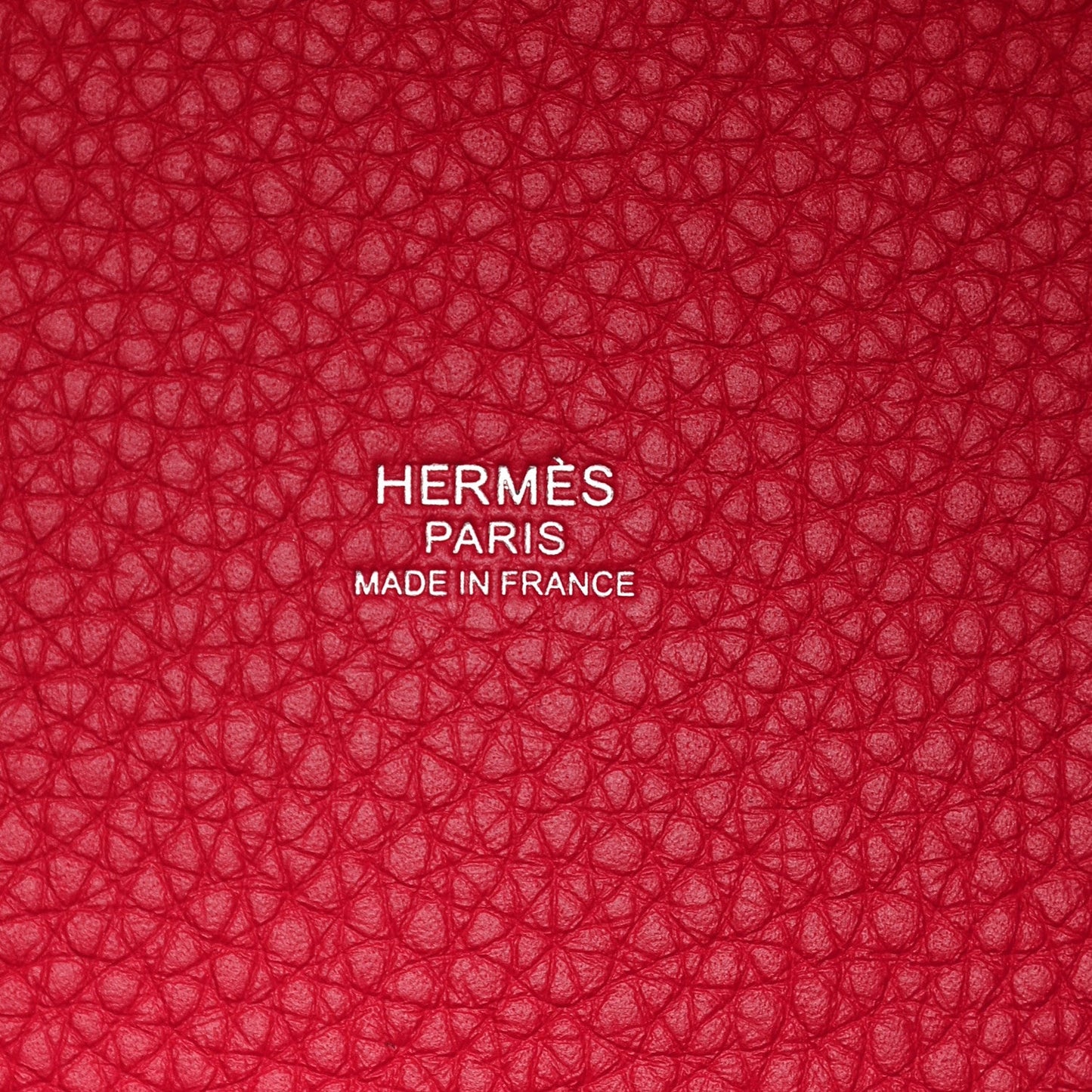 Red textured lining with embossed HERMÈS PARIS and MADE IN FRANCE