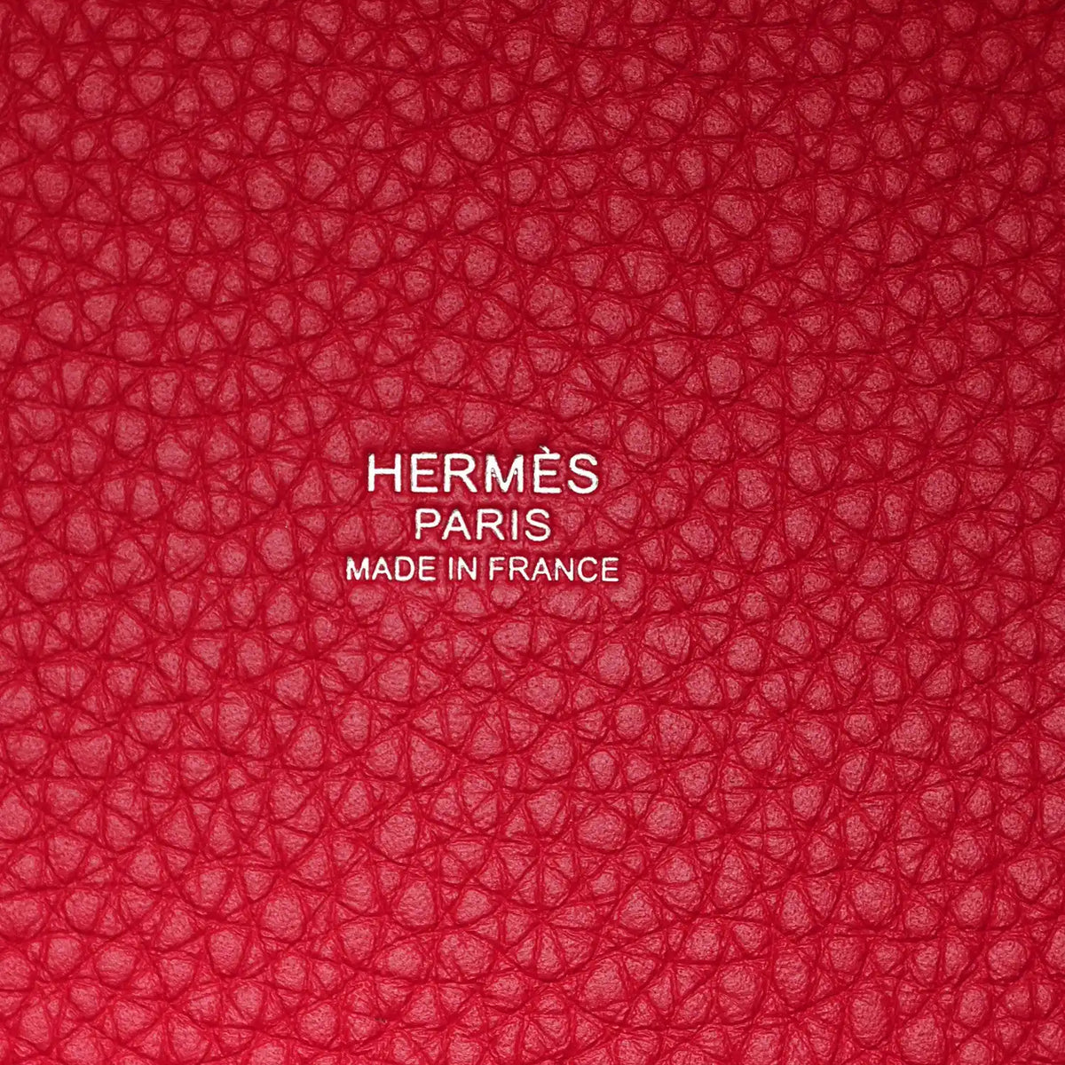 Red textured lining with embossed HERMÈS PARIS and MADE IN FRANCE