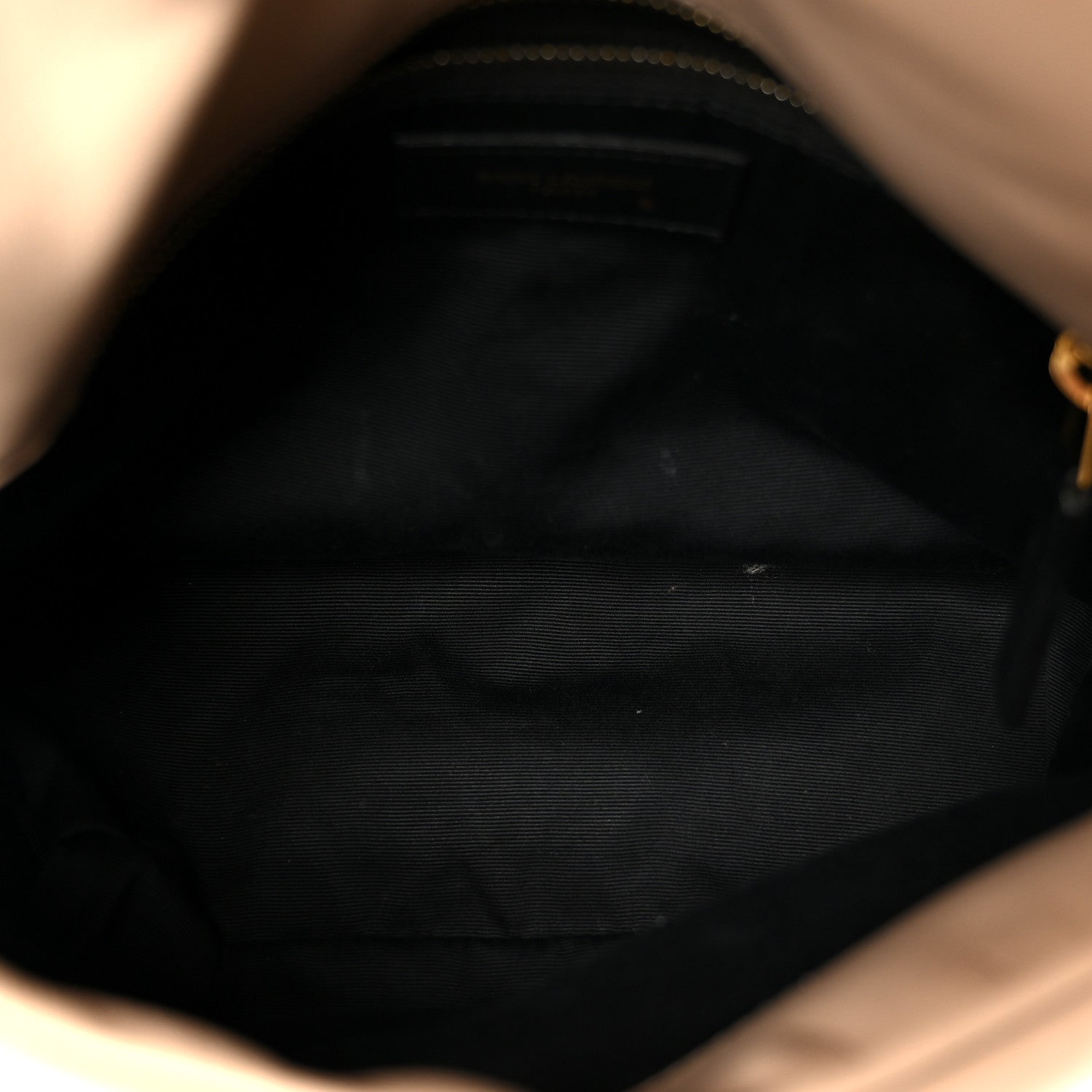 Small puffer chain satchel interior with dark fabric lining