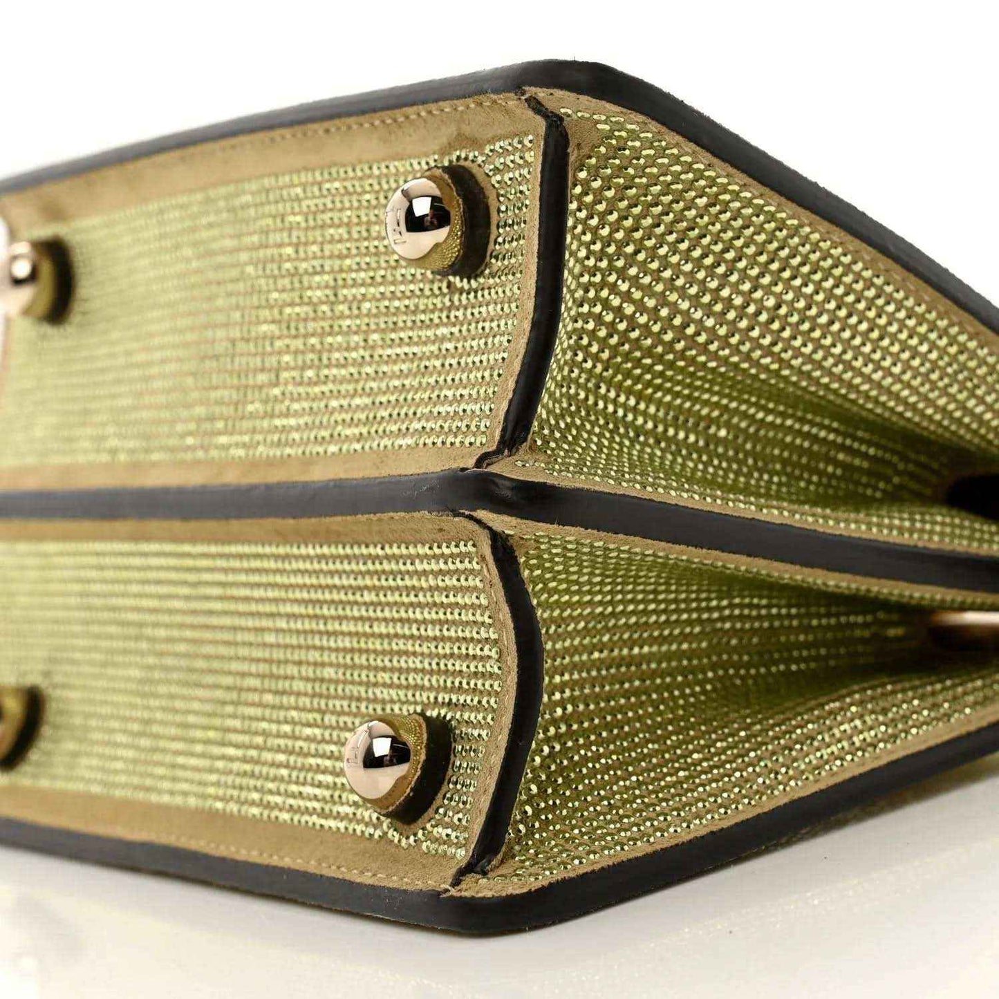 Gold crystal satchel with black trim and two studded snap pockets in view