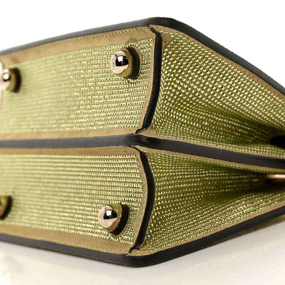 Gold crystal satchel with black trim and two studded snap pockets in view