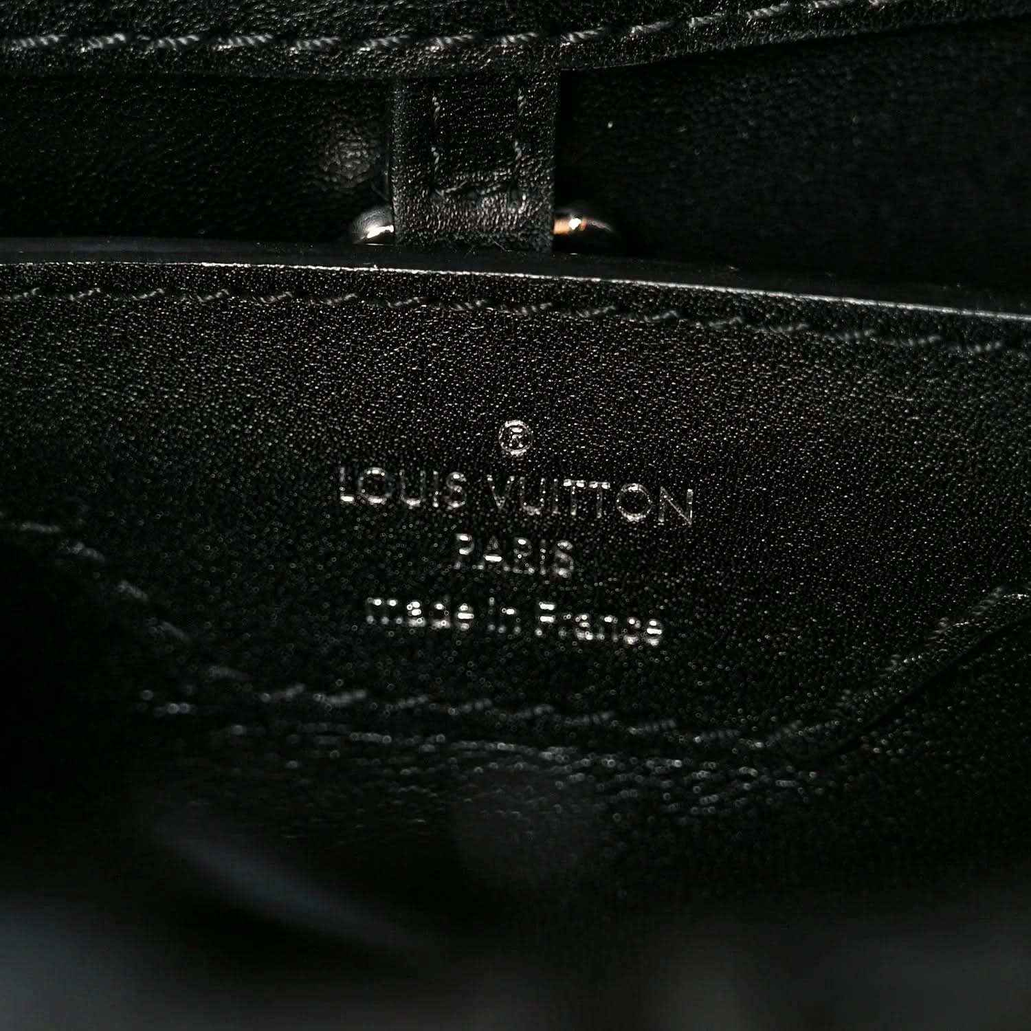 Louis Vuitton Paris made in France stamp on black leather lining with stitching