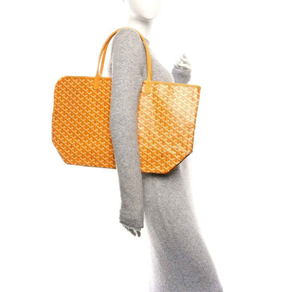 Yellow canvas tote bag with Goyardine pattern and orange top handles