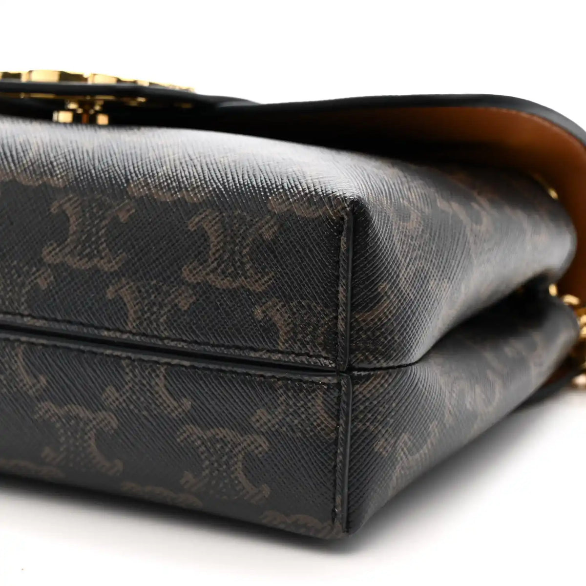 Celine Triomphe shoulder bag bottom corner close-up with dark canvas and gold-toned detail