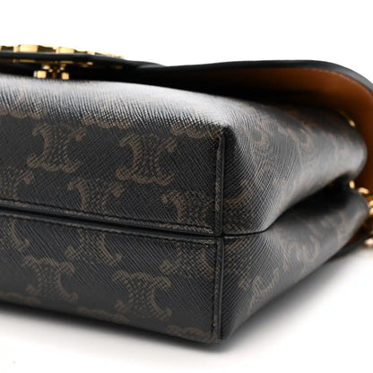 Celine Triomphe shoulder bag bottom corner close-up with dark canvas and gold-toned detail