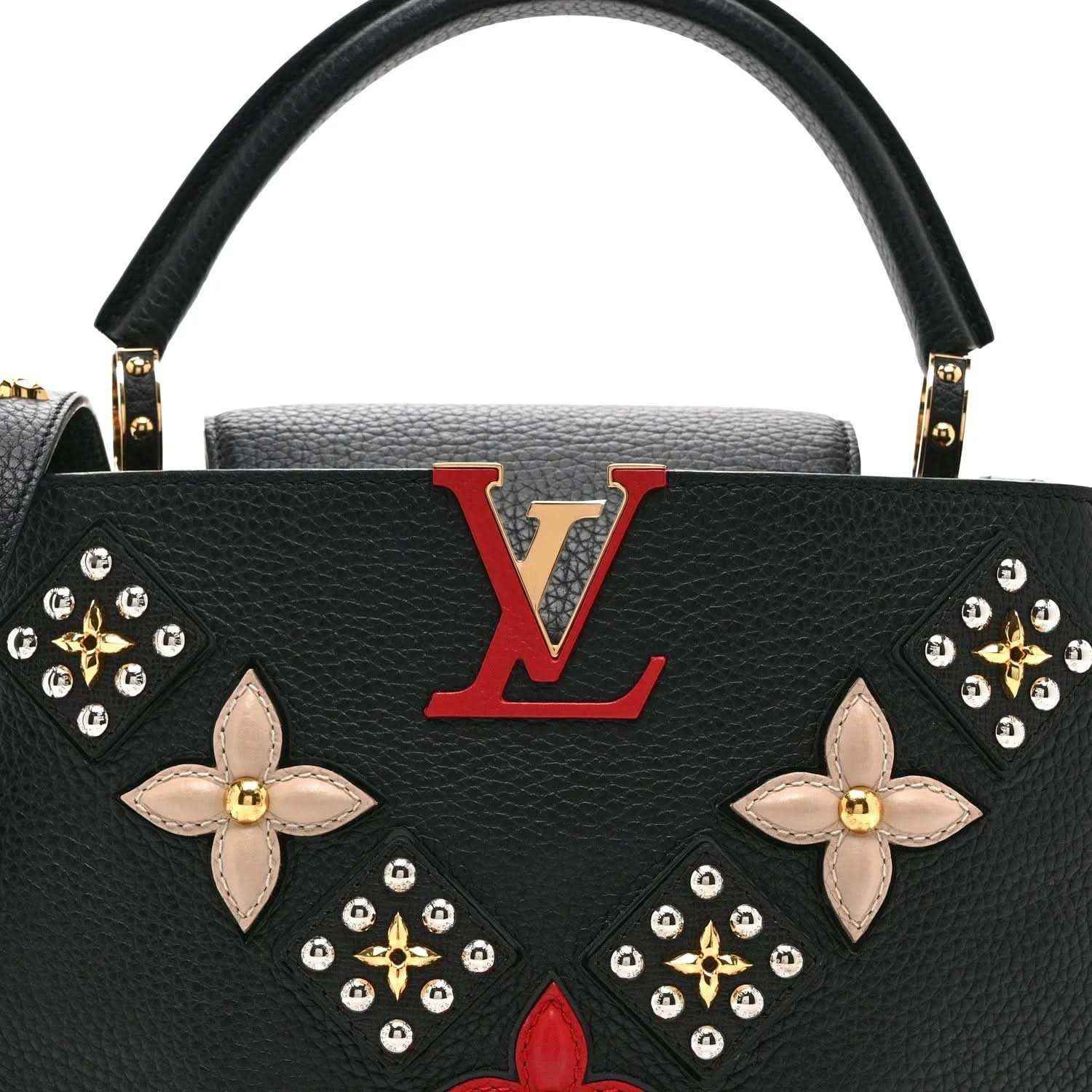 Black Louis Vuitton handbag front with red LV emblem and floral butterfly embellishments