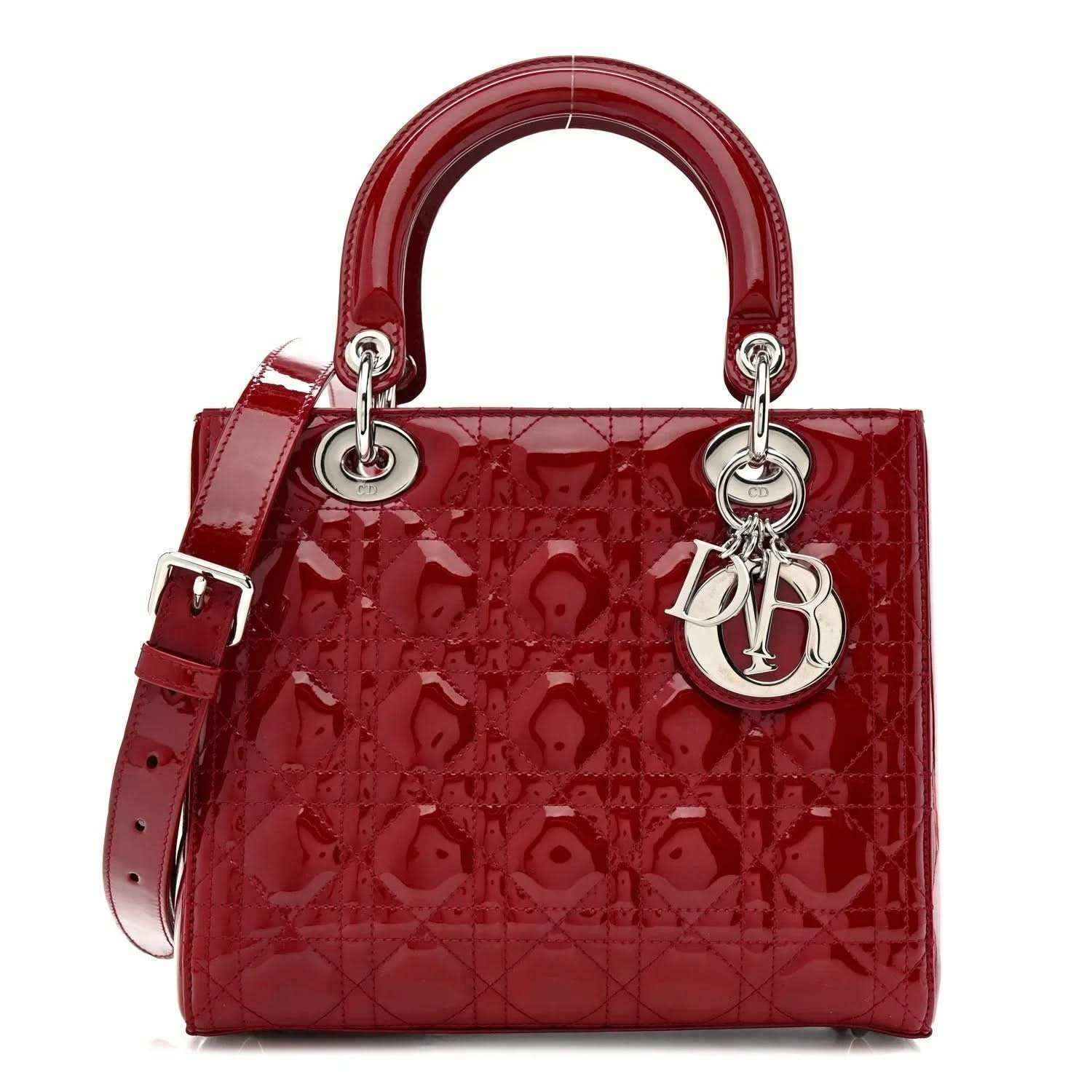 Red patent leather Lady Dior handbag with top handles and silver hardware.