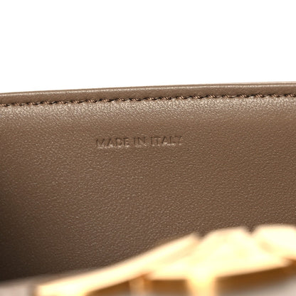 Made in Italy embossed on beige leather