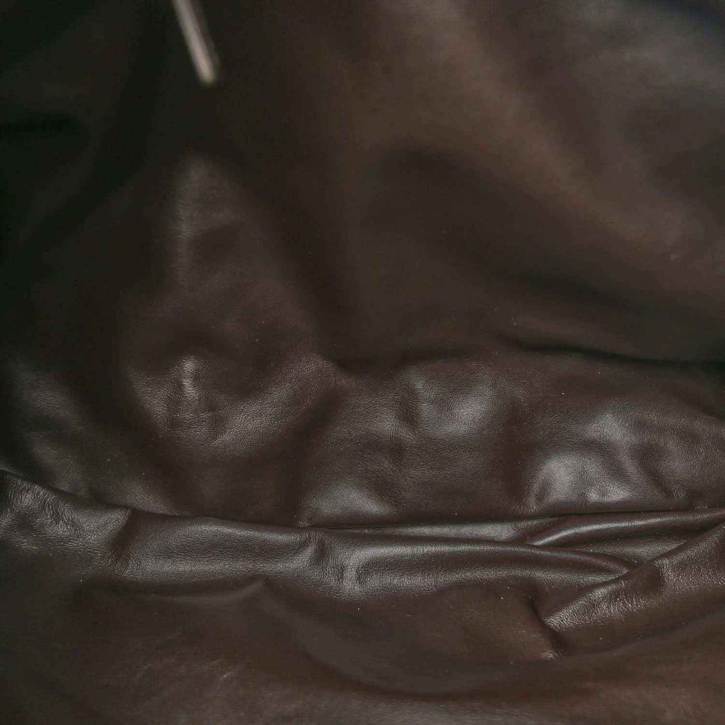 Leather fabric close-up with smooth finish and subtle creases
