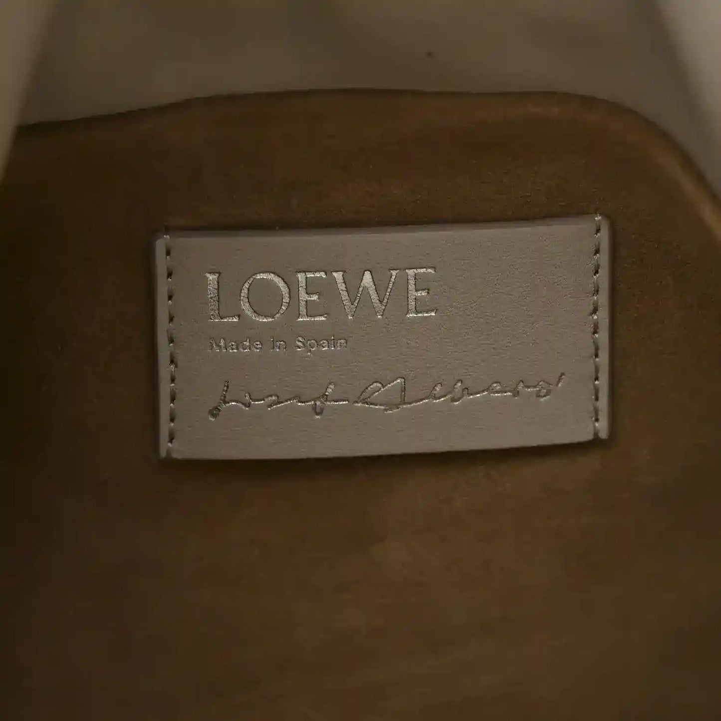 Clutch interior label reading LOEWE and Made in Spain