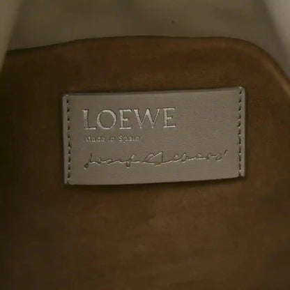 Clutch interior label reading LOEWE and Made in Spain