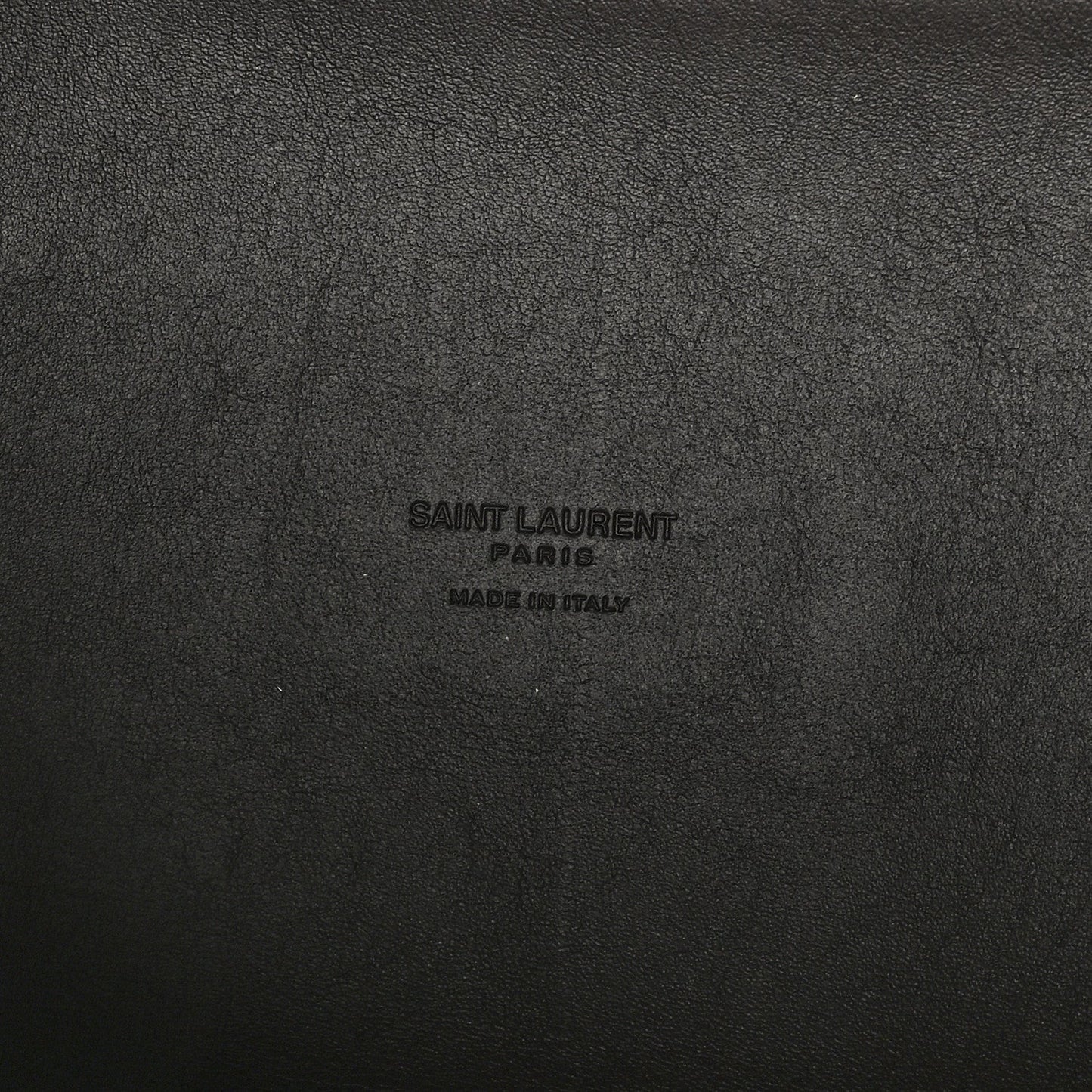 Leather hobo bag exterior with embossed Saint Laurent Paris logo text