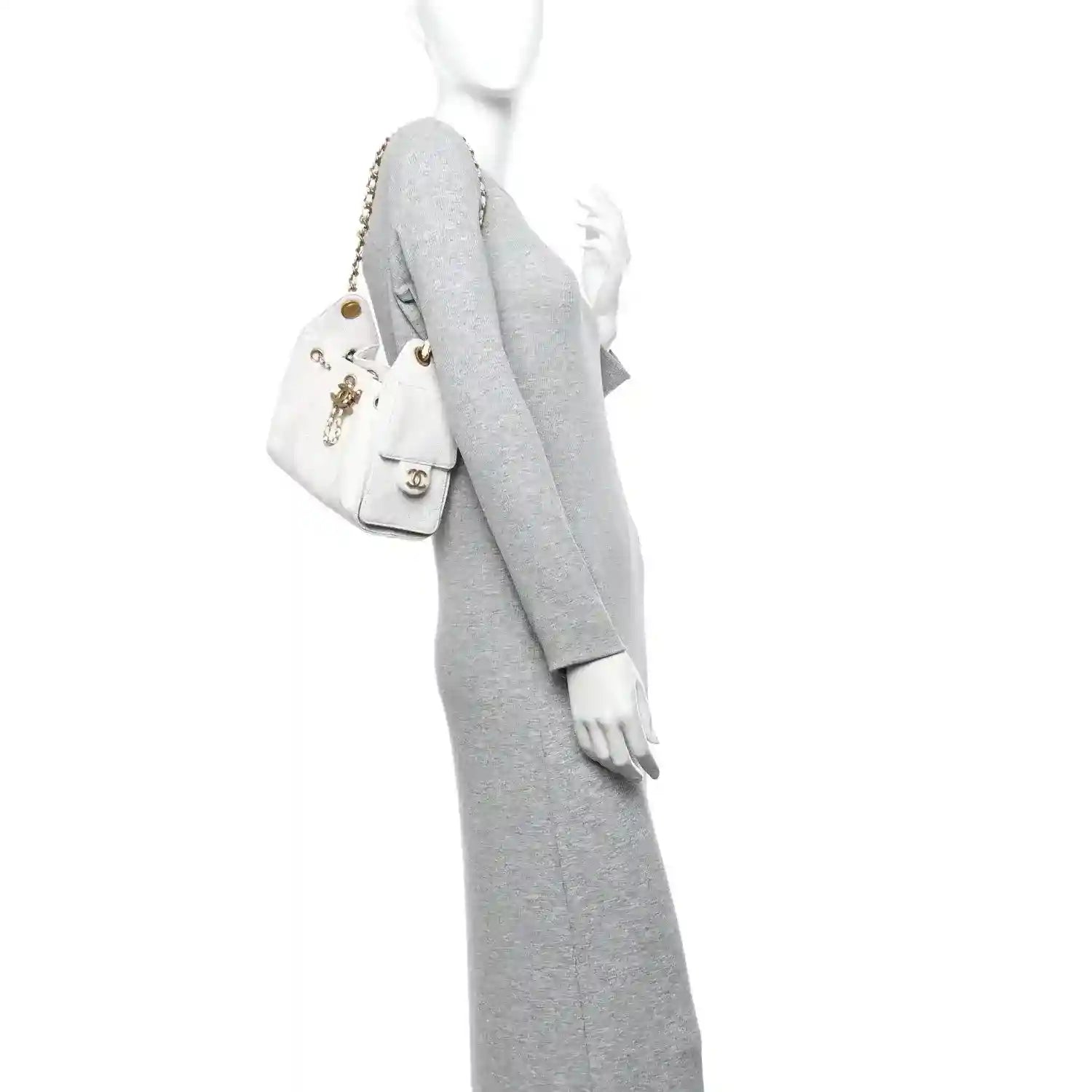White quilted mini handbag with gold chain strap and front charm detail