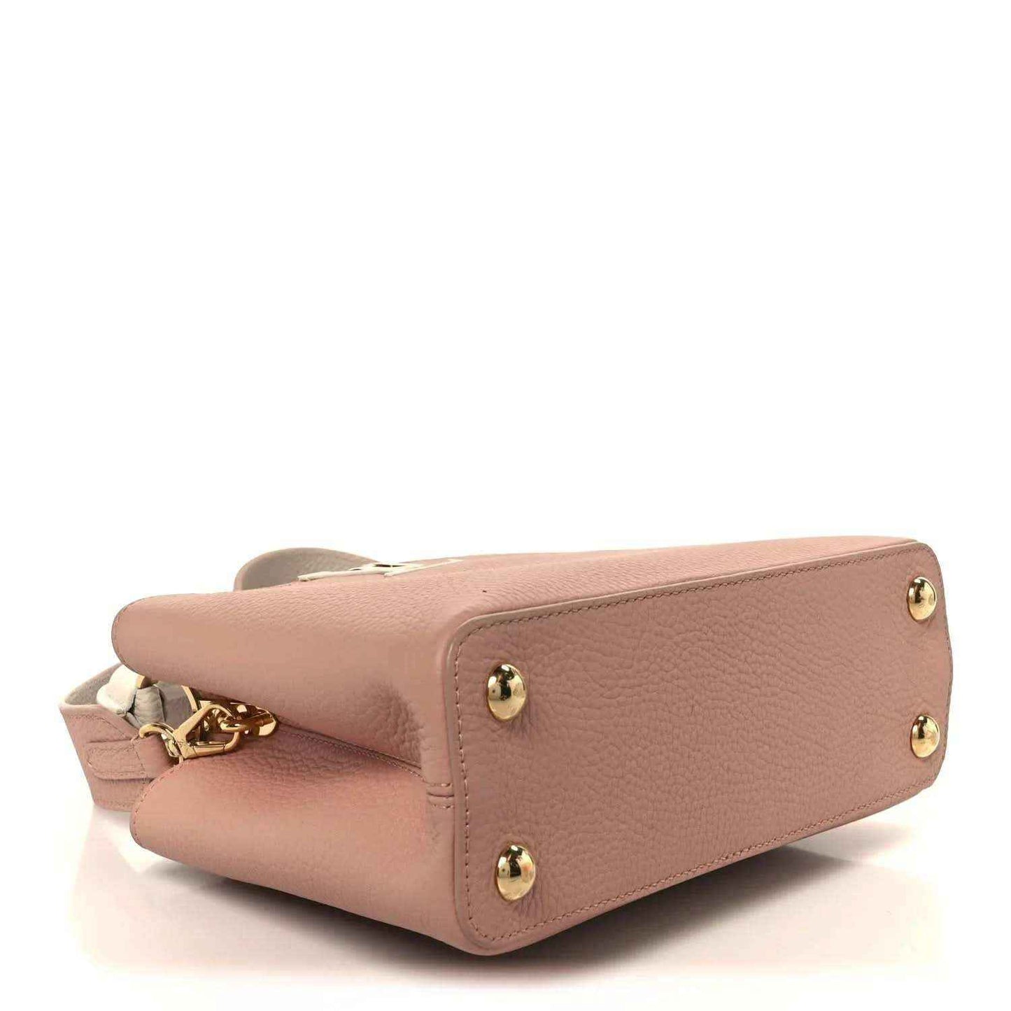 Rose leather handbag bottom corner with gold studs and attached strap