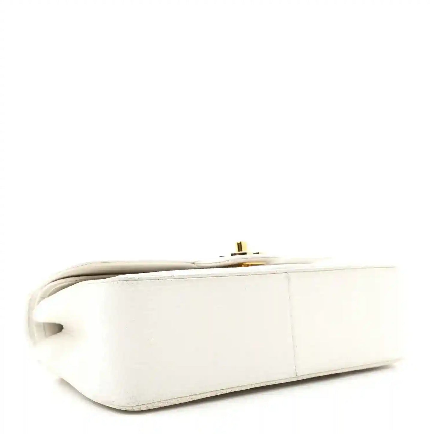 White leather mini bag side view with gold-tone hardware and top edge