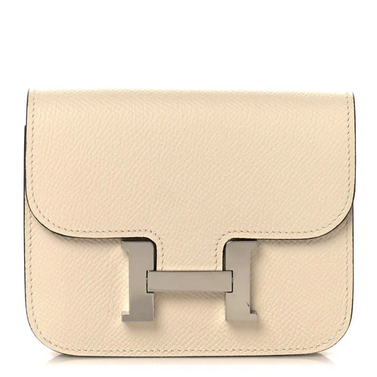 Slim Constance wallet in Nata textured leather with front clasp detail