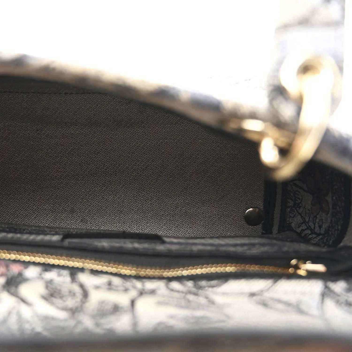 Christian Dior embroidered denim bag interior pocket with zipper and gold trim