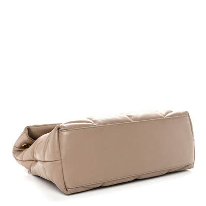 Dark beige puffer quilted satchel back view with stitched paneling