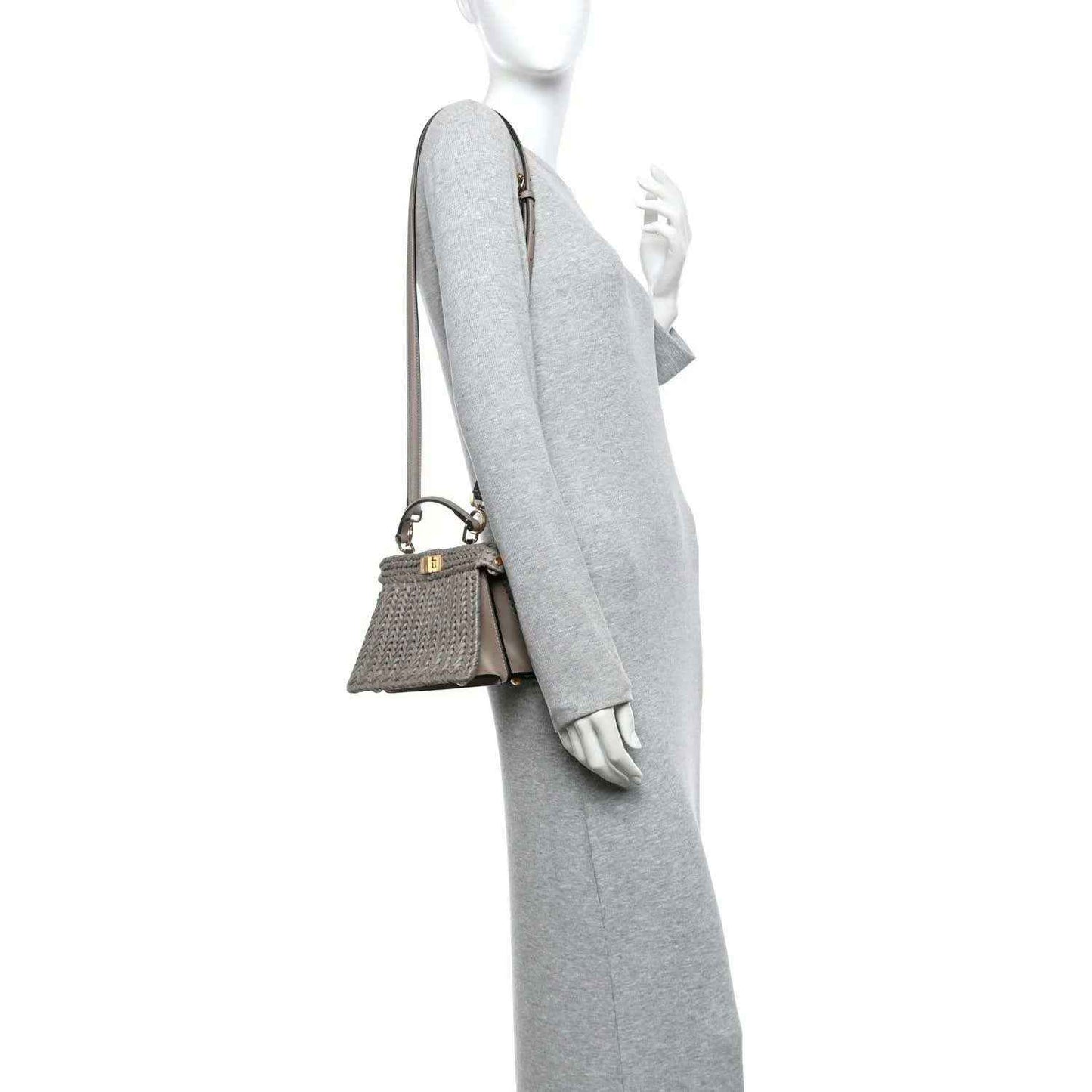Gray woven raffia satchel with adjustable crossbody strap and gold hardware