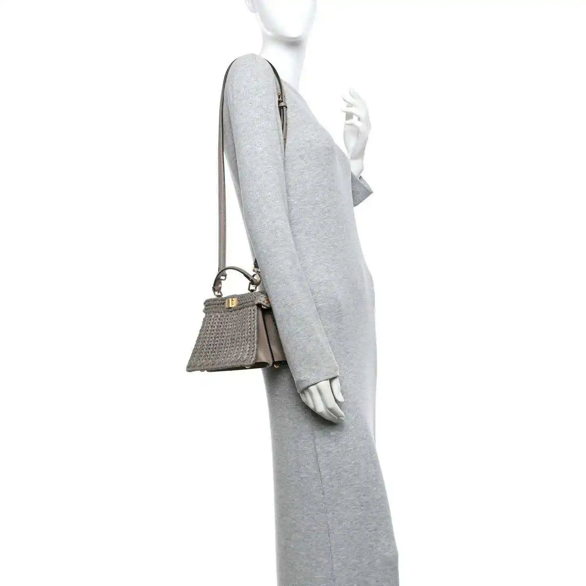 Gray woven raffia satchel with adjustable crossbody strap and gold hardware