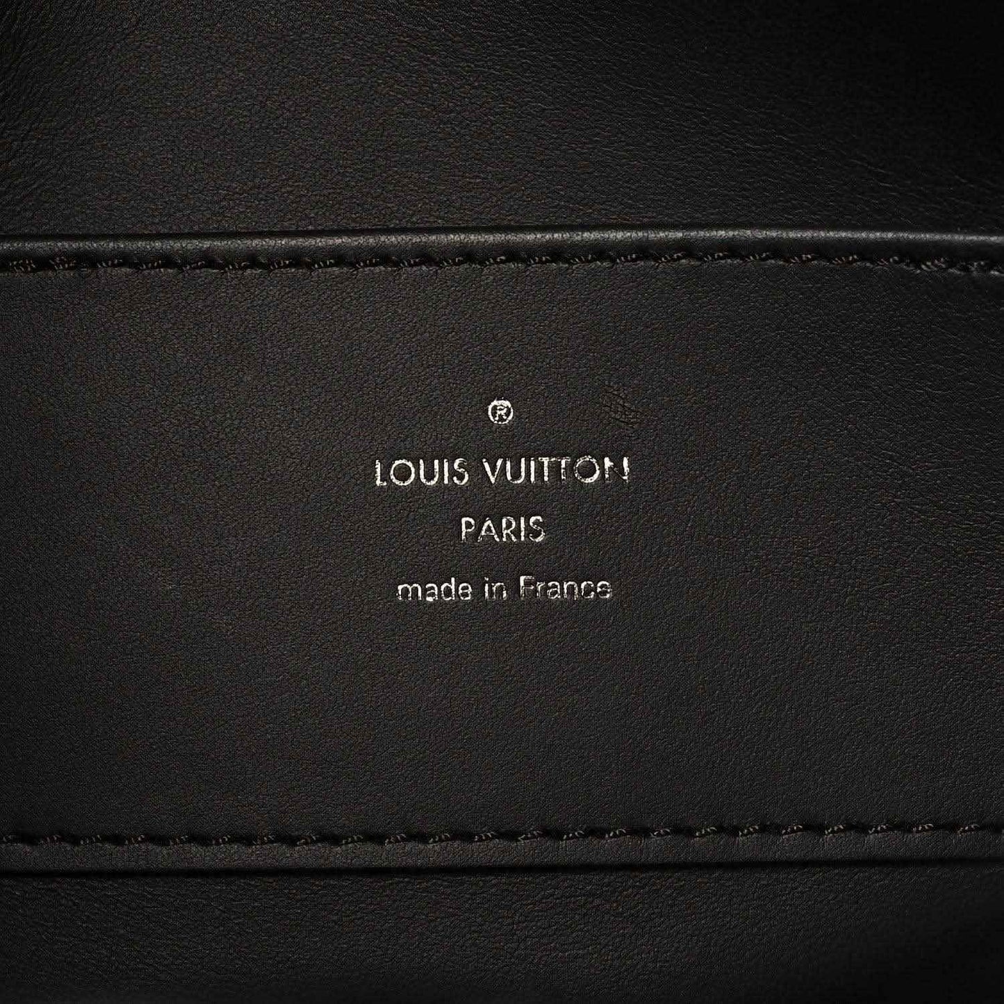Black leather handbag interior label with Louis Vuitton Paris and made in France