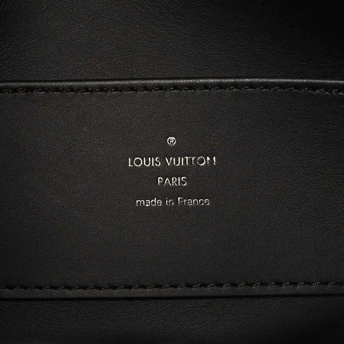 Black leather handbag interior label with Louis Vuitton Paris and made in France