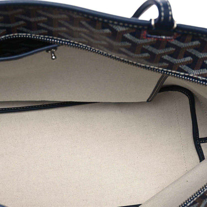 Navy tote bag interior showing zipper track and stitched top opening
