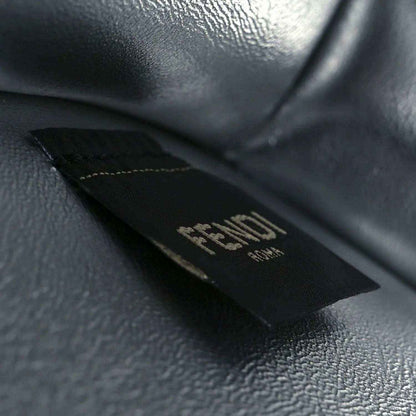 Fendi logo patch on dark leather interior lining of the satchel