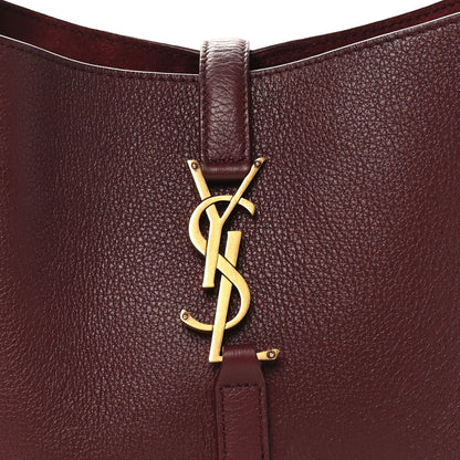 Burgundy leather hobo bag with gold YSL logo charm at center front