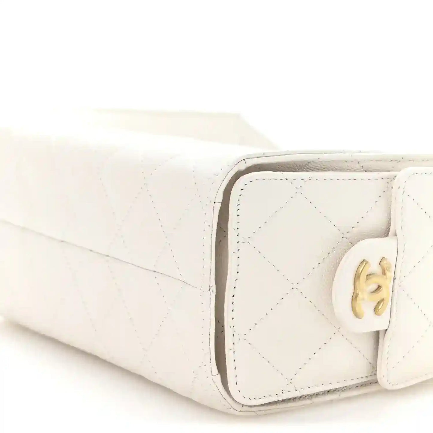 White quilted mini handbag corner close-up with CC turn-lock hardware
