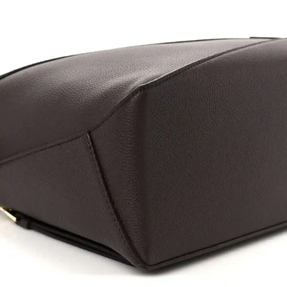 Small Puzzle Edge bag in dark chestnut grained leather, sculpted corner seam