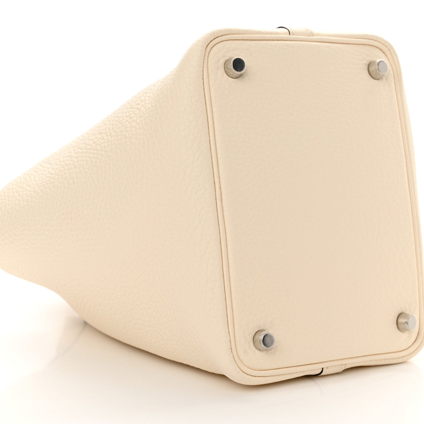 Nata leather handbag with lock hardware and pebble-grain texture, angled view