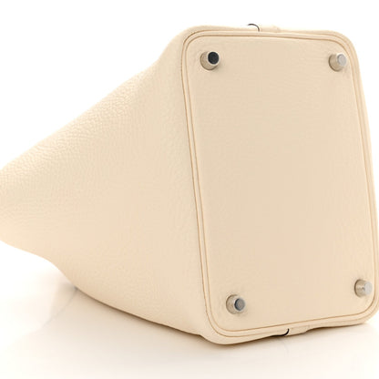 Nata leather handbag with lock hardware and pebble-grain texture, angled view