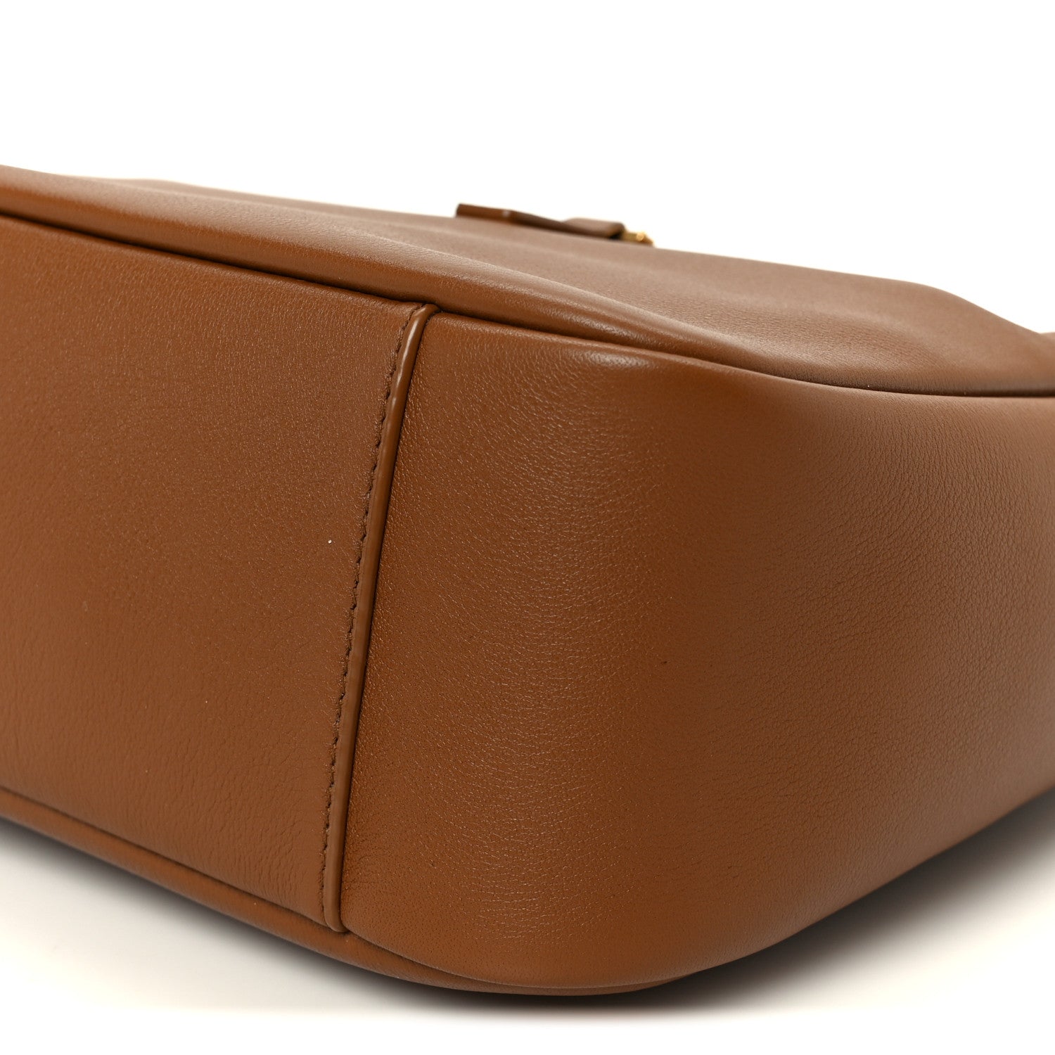 Saint Laurent hobo bag close-up of smooth brown leather top edge and side seam