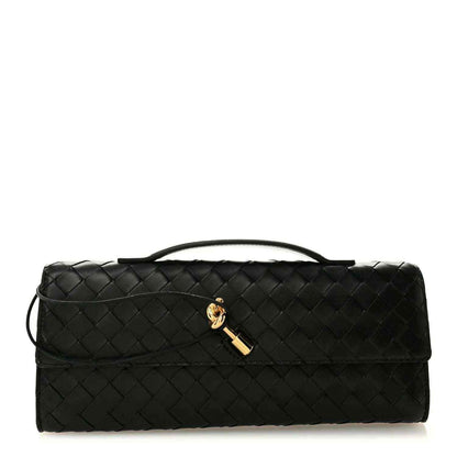 Black woven leather top-handle clutch with gold clasp