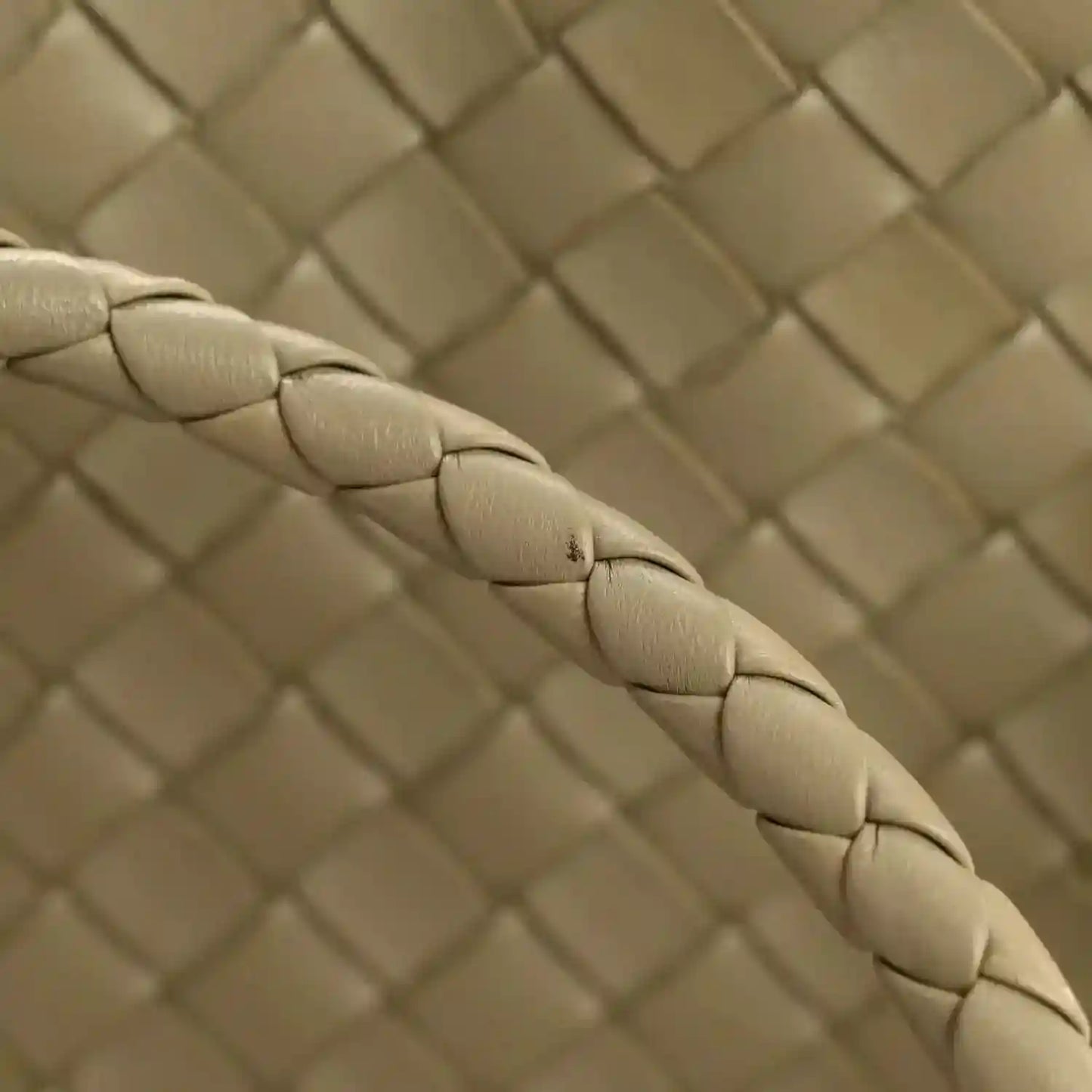 Tan intrecciato woven nappa leather shoulder bag panel close-up