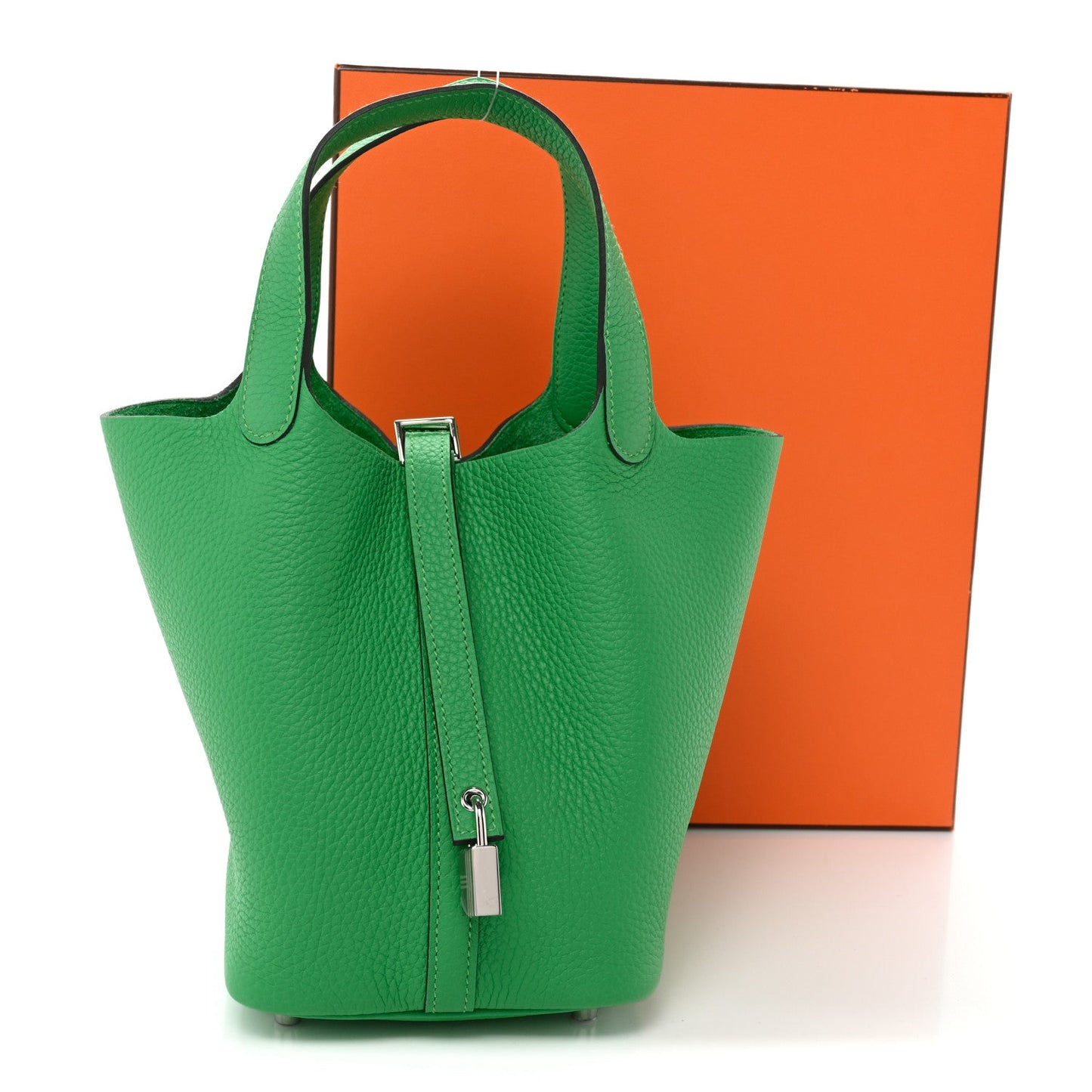 Green leather tote bag with top handles and center zipper lock hardware